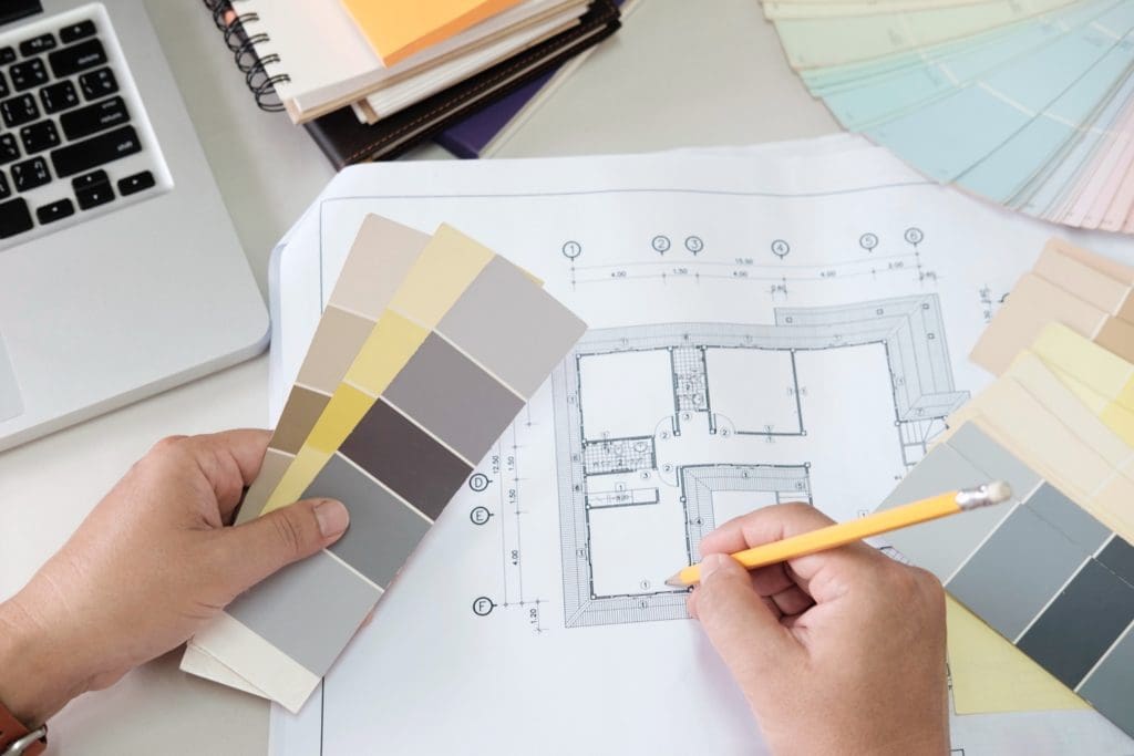 graphic design color swatches pens desk architectural drawing with work tools accessories copy 1024x683 - Cum amenajezi o locuință dedicată închirierii